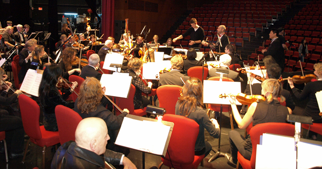 Richard Tyce with Nicholas Urquhart rehearsing with the Solstice Symphony and Jack Li (Tenor)